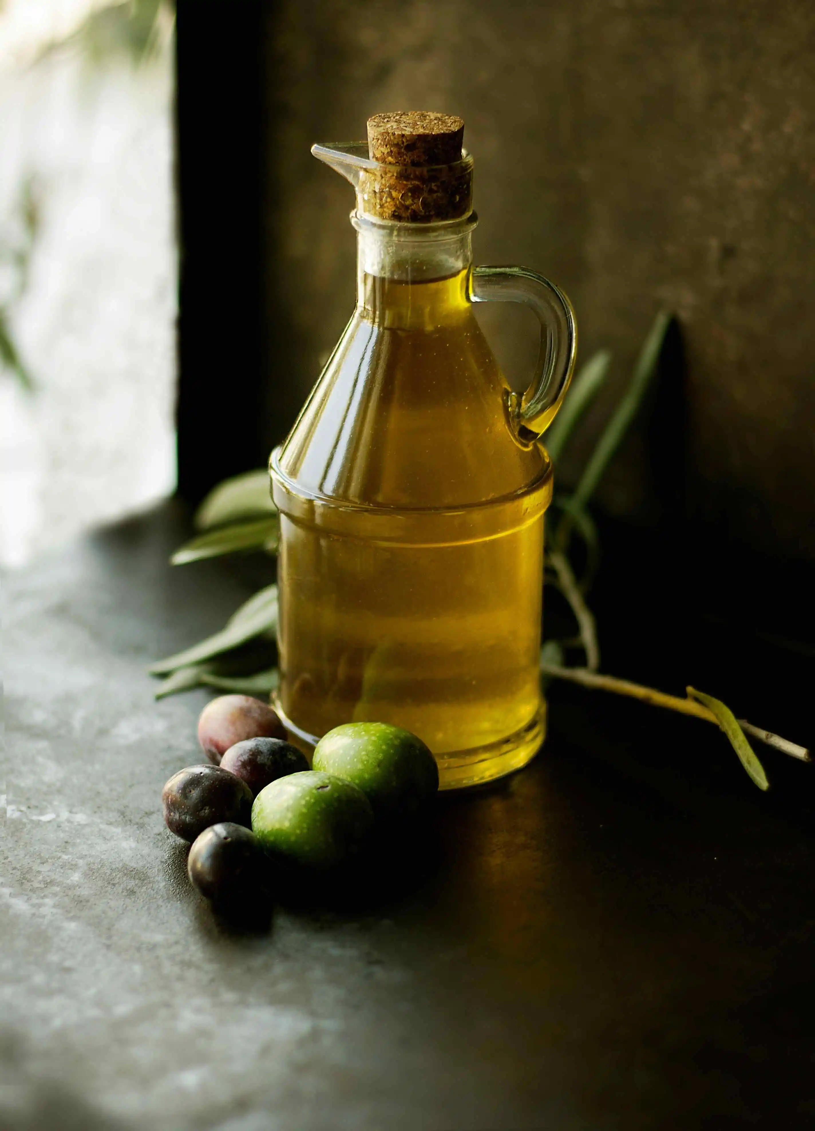 Bottle of olive oil - the healthy fat used in Sauzzy sauces
