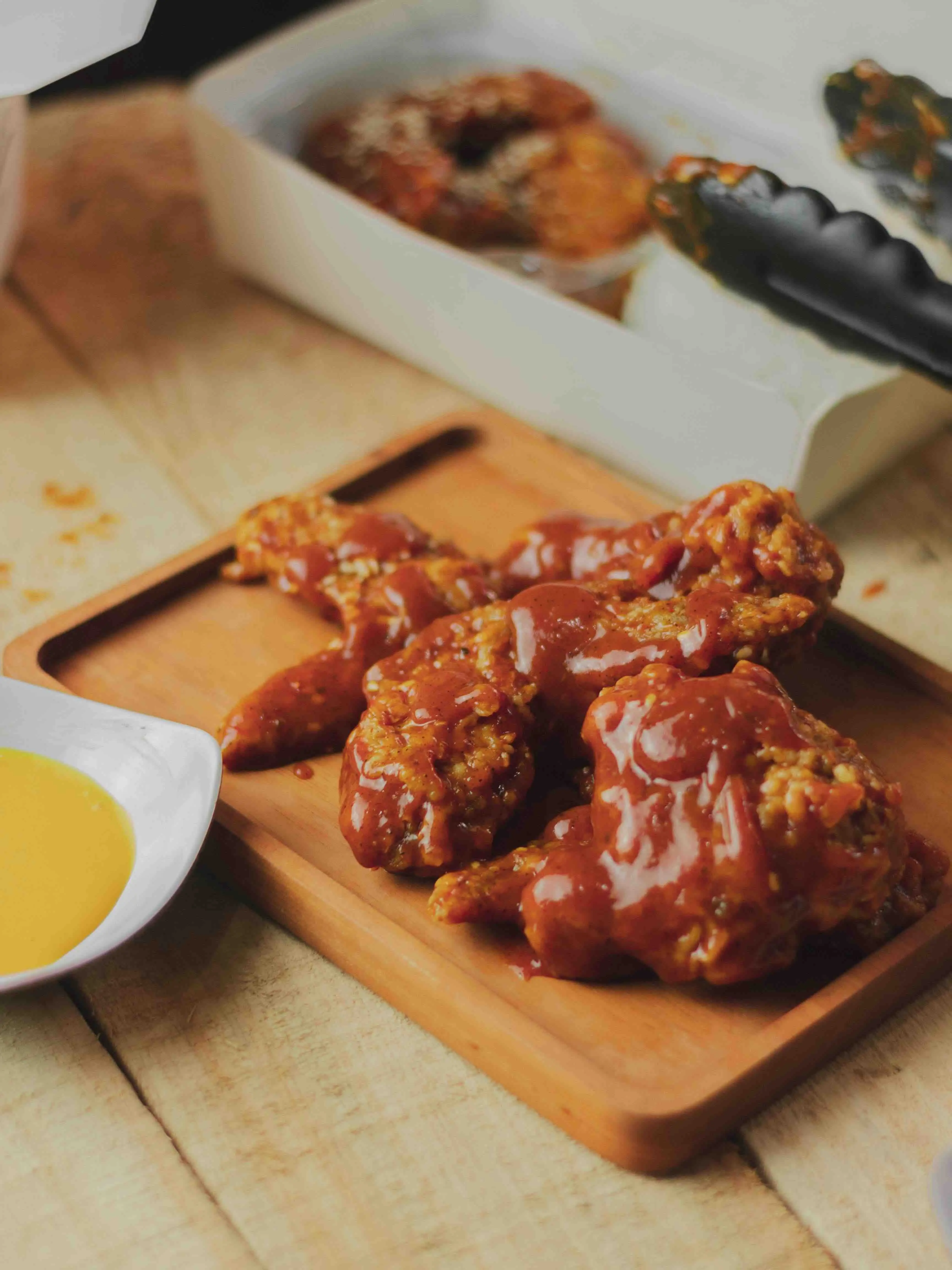 An image of crispy chicken smothered with Sauzzy Chick Sauce - the low-cal version of Chick-fil-A sauce - showing perfect balance and foodie enjoyment