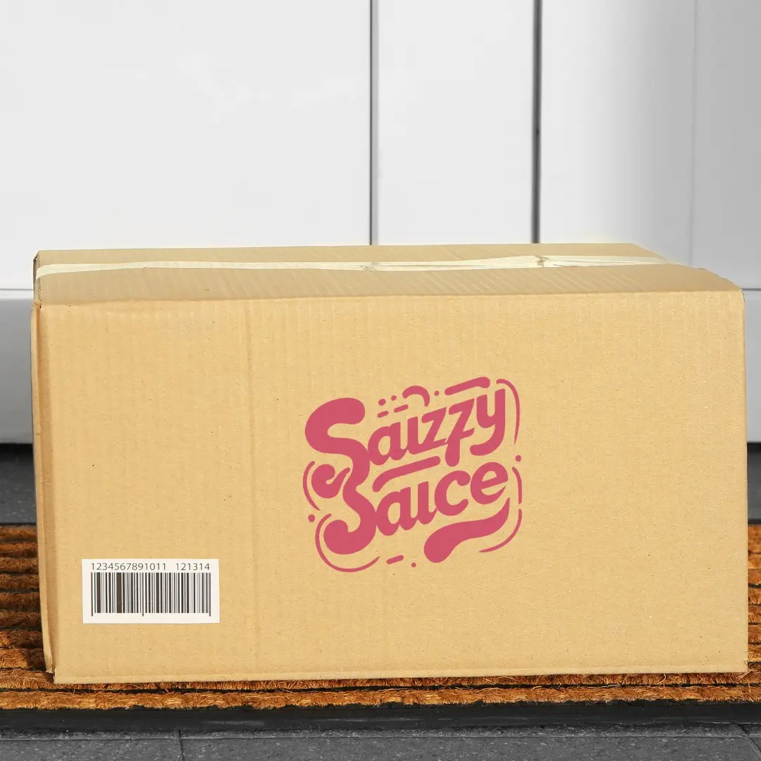 An image of a Sauzzy Sauce order being delivered at someone's doorstep. A box with the Sauzzy Sauce logo on the box in front of a door